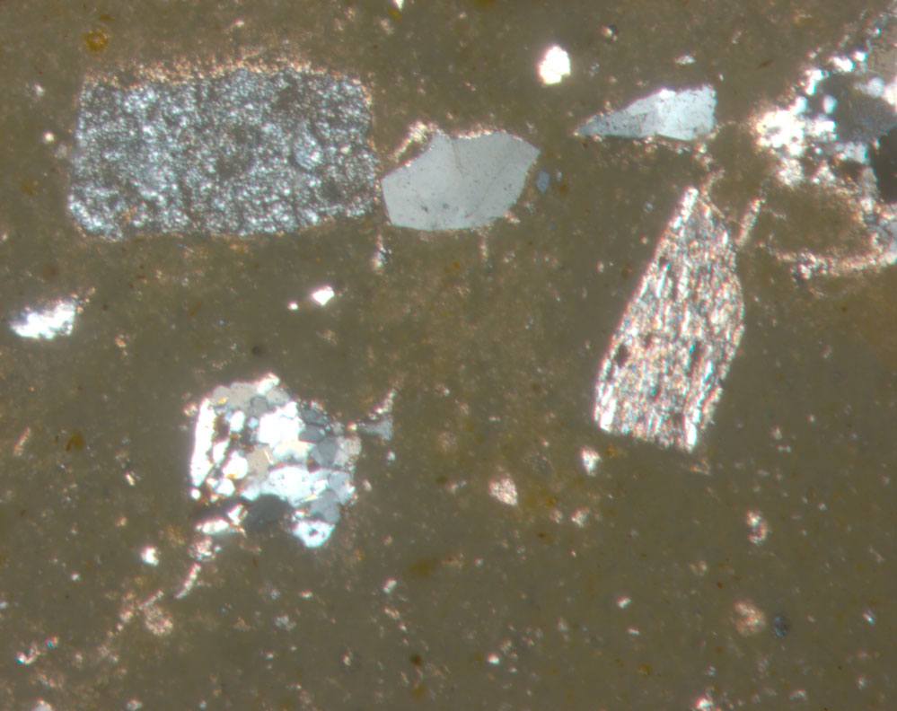 Plate 63.1: Photomicrograph of BAT AM 3 (XPL) (width of field 1.74 mm)