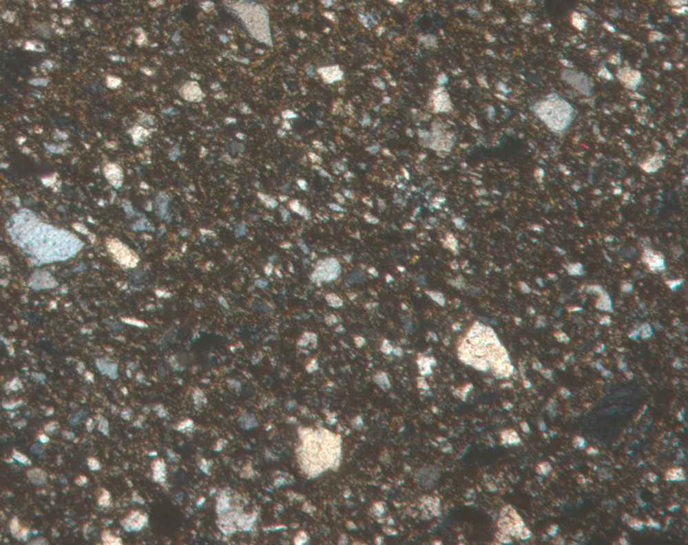 Plate 7.1: Photomicrograph of GAB TR 1A (XPL) (width of field 1.74 mm)